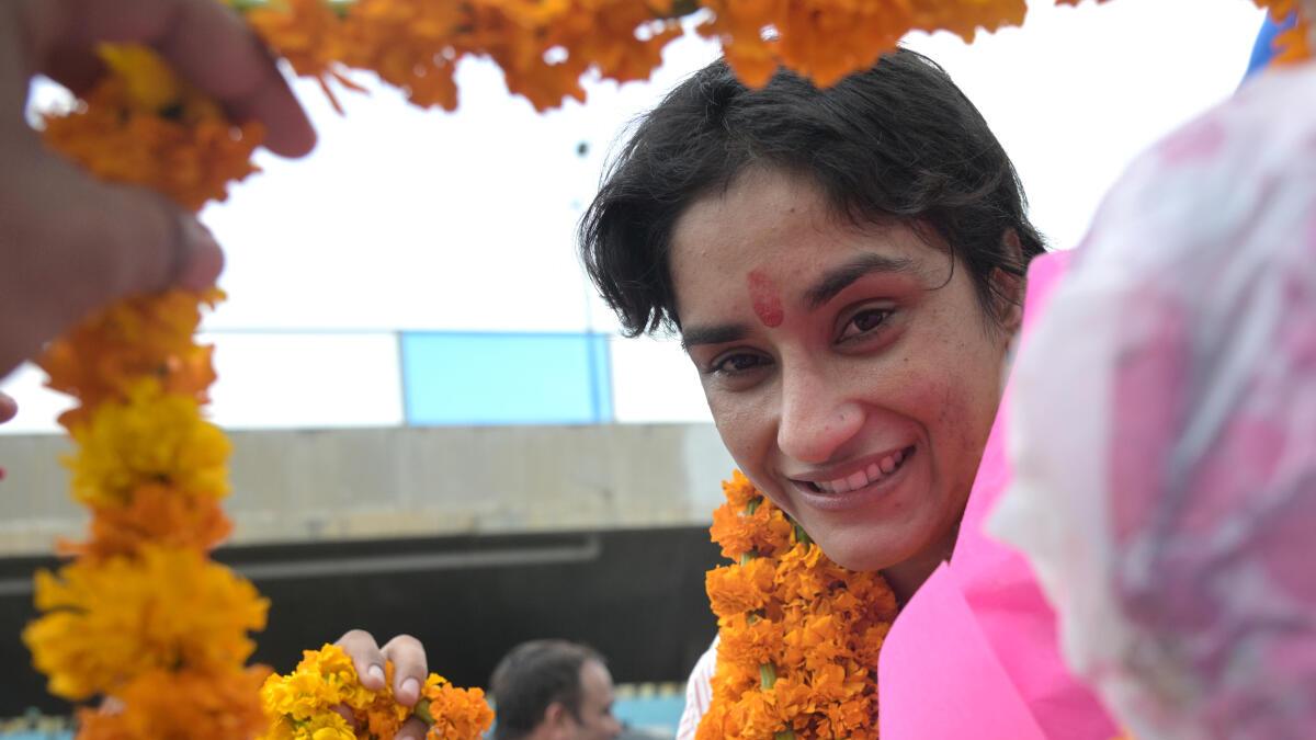 Vinesh Phogat India Arrival Highlights Vinesh honoured with gold medal